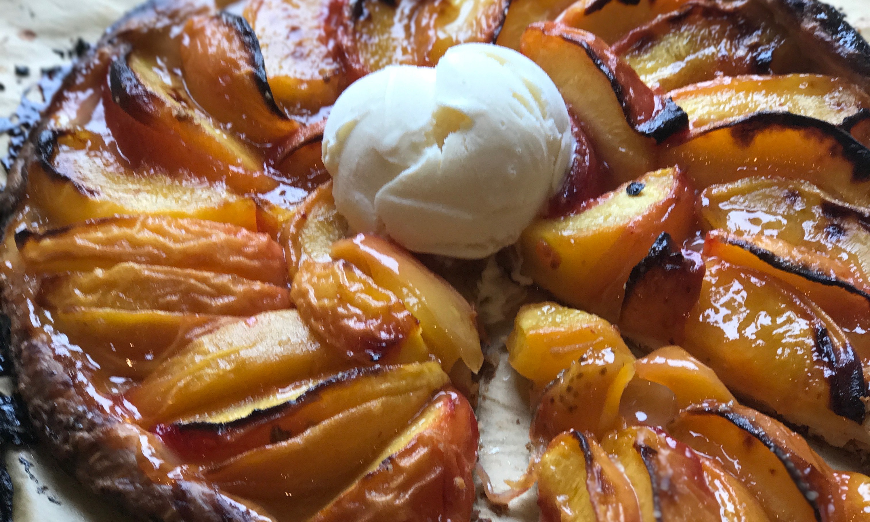 Peach Galette Recipe fresh out of the oven with a scoop of vanilla ice cream | Jessie Sheehan Bakes