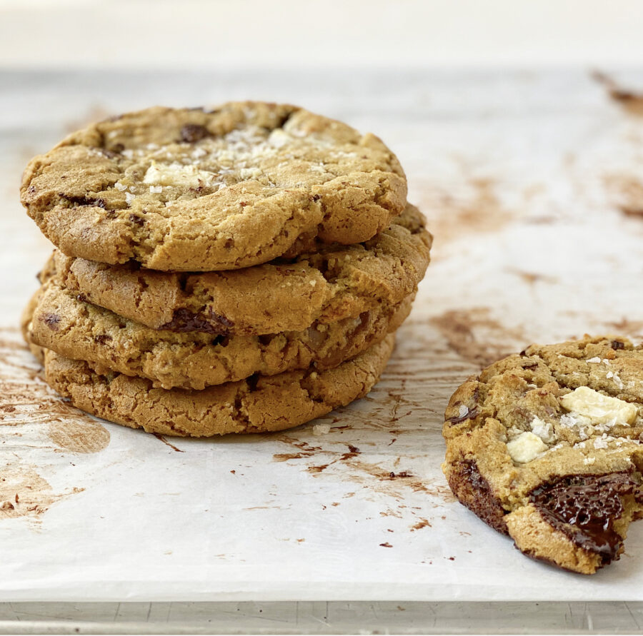 Olive oil triple chocolate chunk cookies stacked